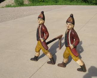 Lot 69. Two matching Hessian soldier antique cast iron andirons