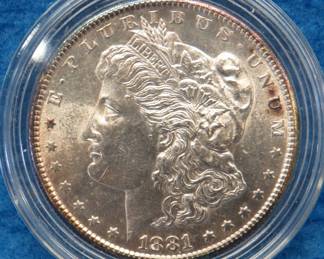 Lot 174. 1881 S Morgan silver dollar from a boxed set.