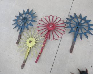 Lot 62. Four non-matching rotary hoe wheels