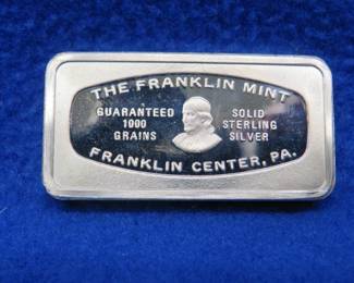 Lot 387. Franklin Mint Bank-marked sterling silver ingot. 65.56 grams.