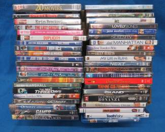 Lot 332. 42 new in the package DVDs. Titles as pictured.