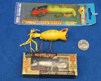 Lot 394. Vintage NIP Tom Mann Pogo Minnow, Arbogast Hula Popper, and an L & S MirrOlure Sinker in a box with papers