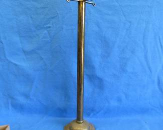 Lot 253. Old brass stand for hanging objects