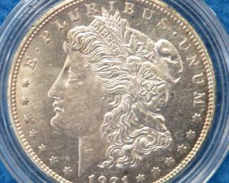 Lot 409. 1921 D Morgan silver dollar from a boxed set. All coins from this set are being sold individually in this auction.