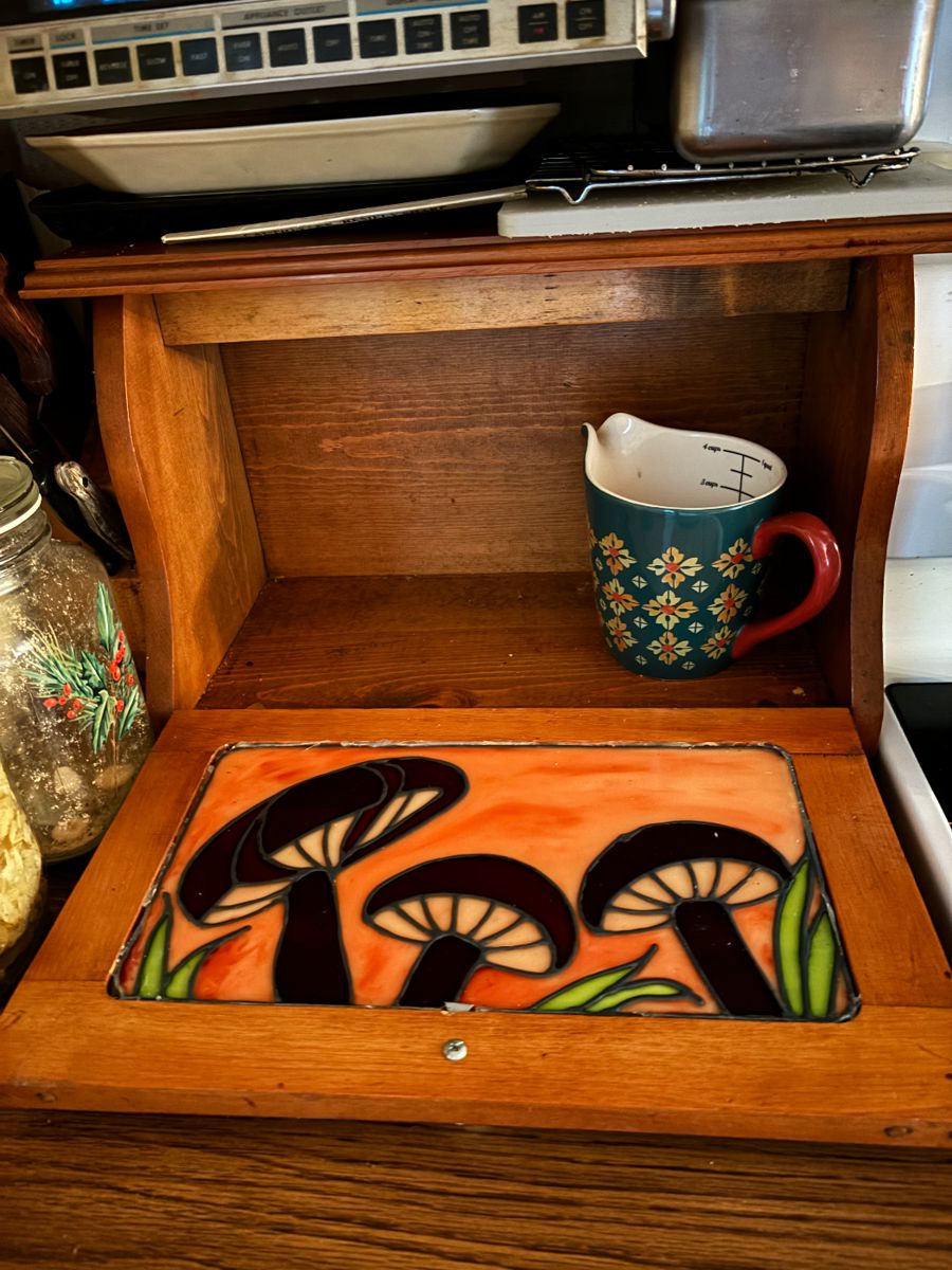 Bread box when it’s opened, with cute mushroom stained glass