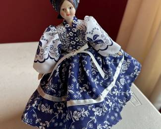 vintage porcelain doll with blue beaded dress 