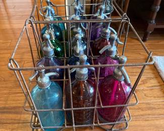 Vintage Seltzer Bottles in a basket 