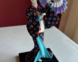 Japanese Geisha doll holding umbrella 