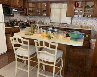 Kitchen full of items, barstools