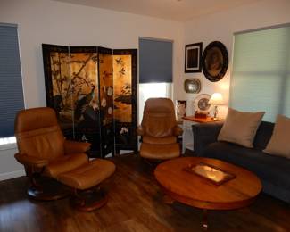 Pair of STRESSLESS recliners and ottoman made in Norway... 4 panel oriental screen behind
