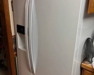 Whirlpool side-by-side refrigerator with water and ice in the door