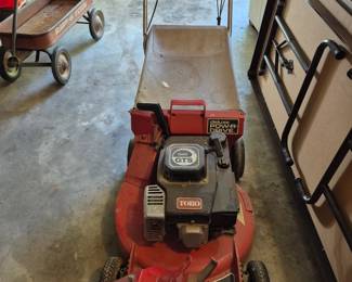 Toro lawnmower with an attachment.
Have not started it.