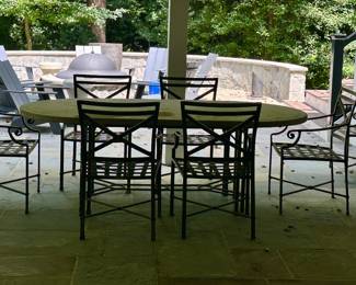 Brown Jordan Oval  Sahara stone top.  84"L  x 42" W on "Venetian" table base.  Eight (8) Brown Jordan "Venetian" armchairs.