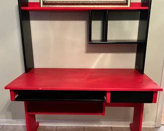 Red and black desk. Well loved, but lots of life left. Available for presale. Text 407-448-3093.