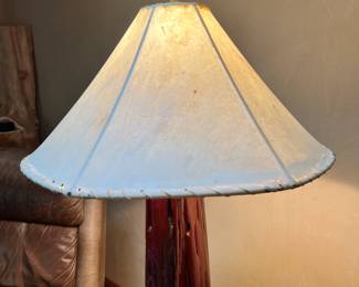 Sidetable/Lamp. Handcrafted by homeowner. Wood base and lampshade made from hide. L-27, W-23, H-63 Available for presale. Text Sara at (407) 448-3093.