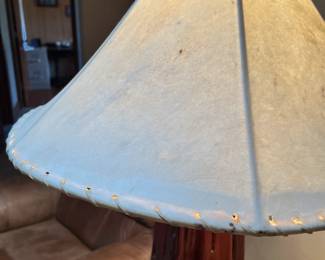 Sidetable/Lamp. Handcrafted by homeowner. Wood base and lampshade made from hide. L-27, W-23, H-63 Available for presale. Text Sara at (407) 448-3093.