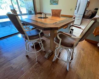 Bistro table. Handcrafted by homeowner. L: 61 inches, W: 44 inches, H: 43 inches. Table & barstools available for presale. Text Sara at (407) 448-3093.