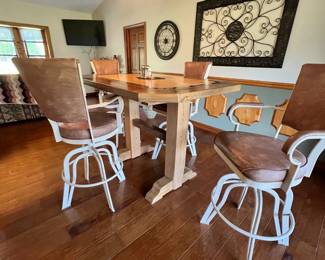 Bistro table. Handcrafted by homeowner. L: 61 inches, W: 44 inches, H: 43 inches. Table & barstools available for presale. Text Sara at (407) 448-3093.