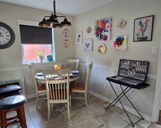 Breakfast table, set of Herdmar Stainless cutlery, colorful wall art ... lots to see here!  