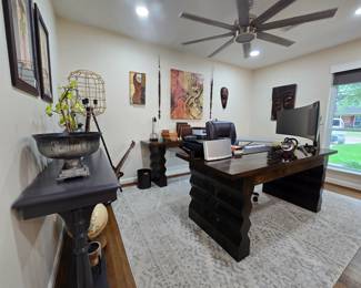 Home office includes heavy-duty wood desk and credenza. 