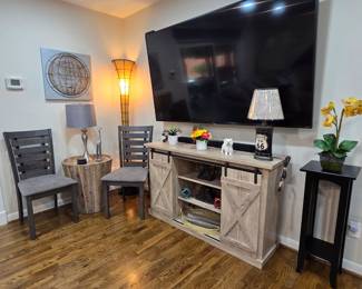 Gray occasional chairs, Farmhouse style TV Entertainment cabinet, side table and eye-catching floor lamp! 