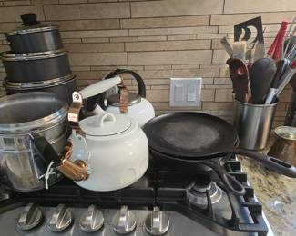 assorted pots and pans, bakeware, cookware, and utensils to choose from