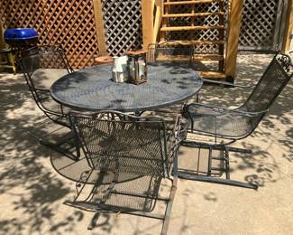 Wrought iron table w 4 rocker chairs