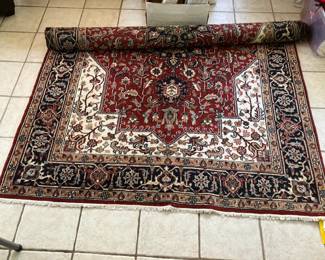70" by 103" hand knotted rug, just professionally cleaned