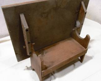 Small tilt top table open to make into a bench, stands about 9 inches tall. Located in barn shed.