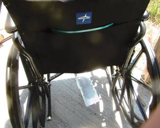 Midline Wheelchair, nearly new. Has leg guards and foot rest.