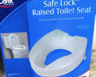 Raised toilet seat still in box