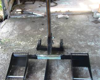 Riding lawnmower lift for changing blades.