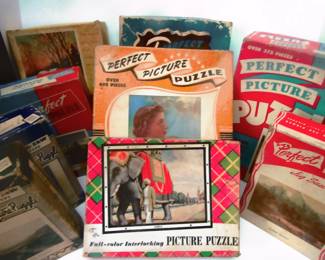 Picture puzzles from the 1940's and 50's. We have not opened them or counted the pcs.