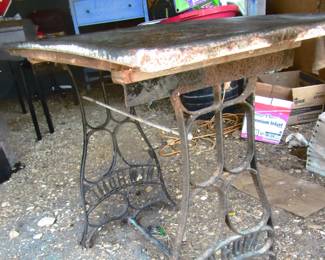 New Home treadle sewing machine base table. Located at barn shed.