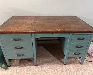 Old teachers desk with spring loaded typewriter shelf inside left door. 
