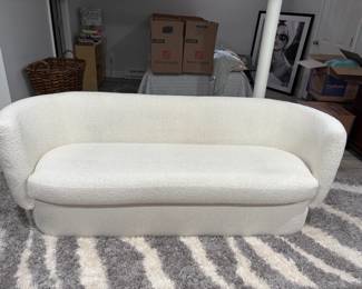 White curved back sofa purchased in 2021 at All Modern for $2000. Excellent condition overall. No stains.