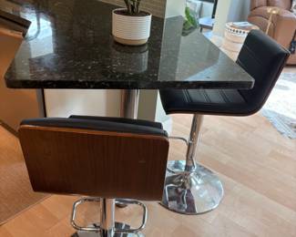 Set of three black faux leather, chrome and wood counter height stools