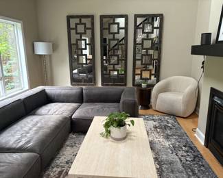 Arhaus dark grey leather sofa purchased in 2022 for $15,000. Very good condition, signs of wear consistent with daily use. Extremely comfortable!