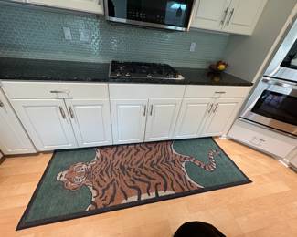 Jonathan Adler tiger padded kitchen rug purchased in 2024 from Amazon for $240. The rug can be easily removed from the pad and washed in the washing machine. Excellent condition, washes up like new.