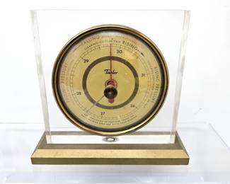 Lot #28 - Vintage Taylor barometer in a Lucite Casing and Gold-Tone Base 4" x 4"