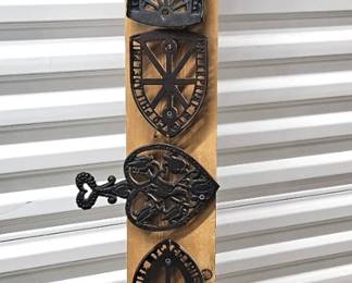 Impressive Display of Vintage and Antique Cast Iron Trivets Nailed on a 5ft Long Board