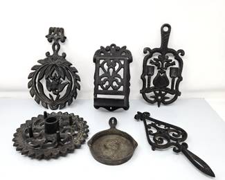Charming assortment of vintage cast iron kitchen Trivets, Candle Holder, & Match Dispenser - Wilton