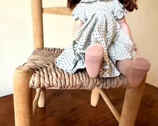 Vintage doll, rush bottom chair
