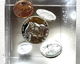 Paperweight with coins
