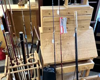 A room full of fishing equipment and supplies, custom work stand for making  lures, etc
