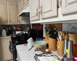 Diezackwerk/Germany and Henckel knives & meat cleavers.......Delonghi toaster...Lodge Cast Iron pots and pans...Madnalite roaster,,,Farberware food processor(12 cups) Cuisinart pans, Red Copper Square pan....more...he loved to cook