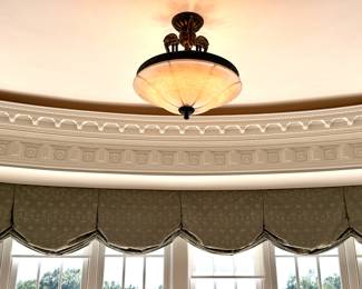 Window Treatments and Overhead Baroque Lighting Fixture