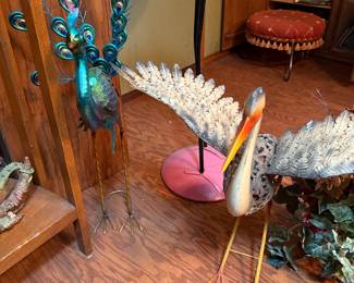 Metal peacock and metal crane yard art