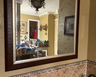 large wood framed mirror