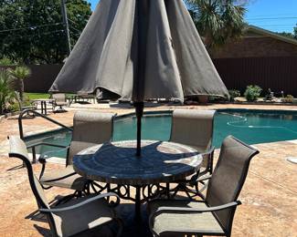 Stone top and metal patio table with 4 chairs and umbrella